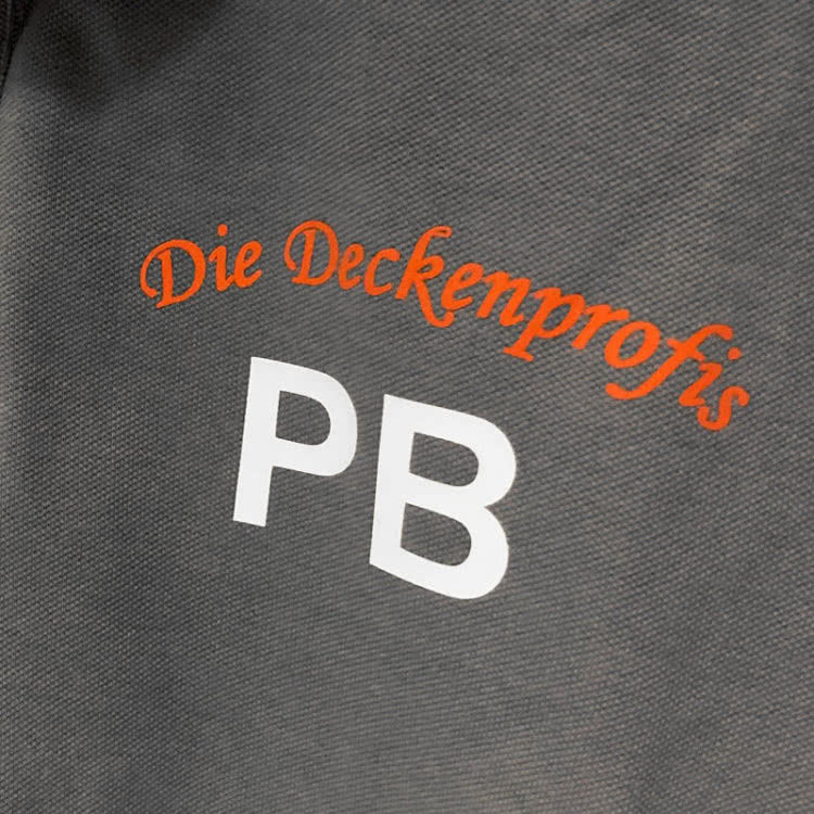 Die Deckenprofis Logo auf den adidas Poloshirts