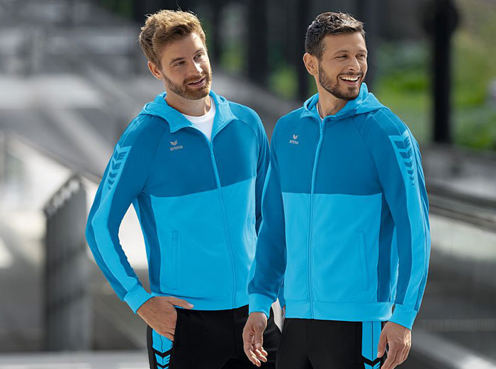 Die Erima Six Wings Trainingsjacke mit Kapuze als Freizeitjacke für den Teamsport